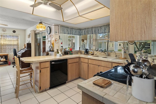 kitchen with sink, kitchen peninsula, light tile patterned floors, tile counters, and dishwasher