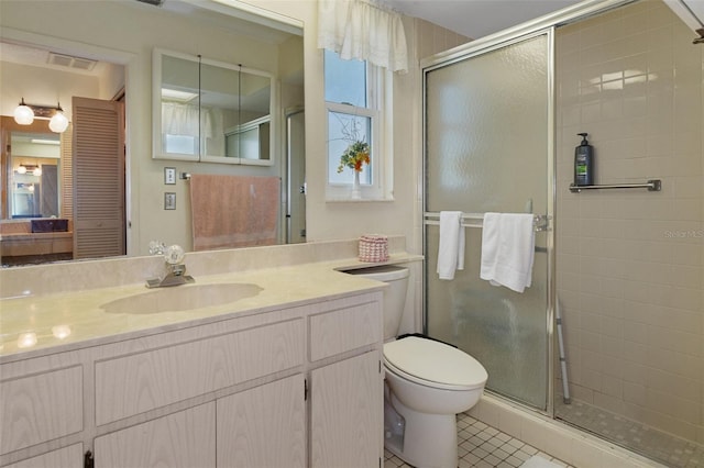 bathroom featuring toilet, an enclosed shower, vanity, and tile patterned floors