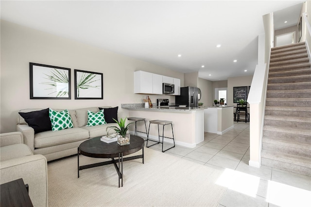 living room with light tile patterned flooring