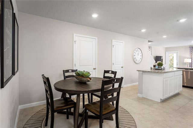 dining room featuring a textured ceiling