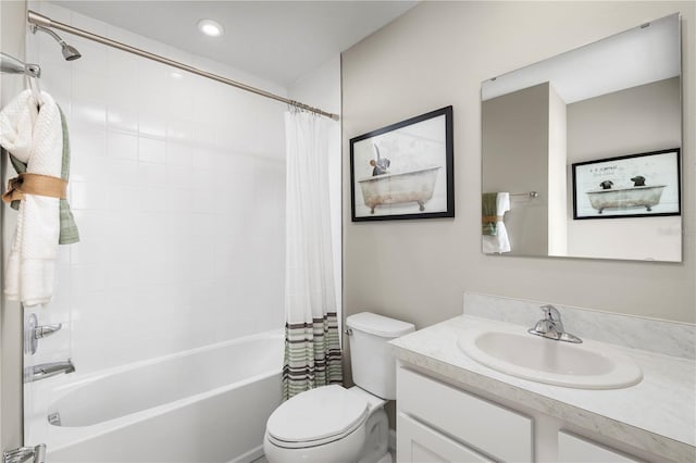 full bathroom featuring toilet, vanity, and shower / bath combo with shower curtain