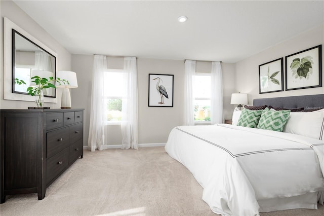 bedroom with light colored carpet