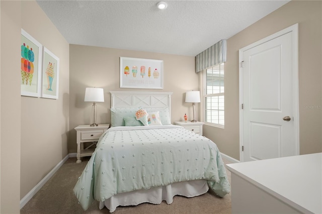 bedroom with carpet flooring and a textured ceiling