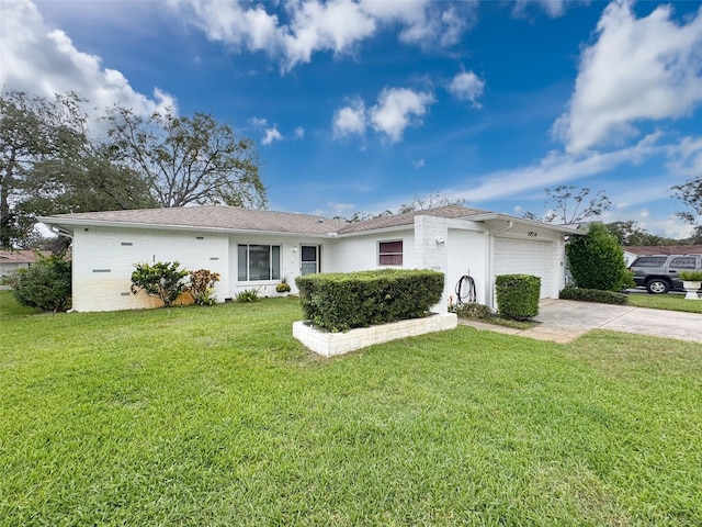 ranch-style home with a garage and a front yard