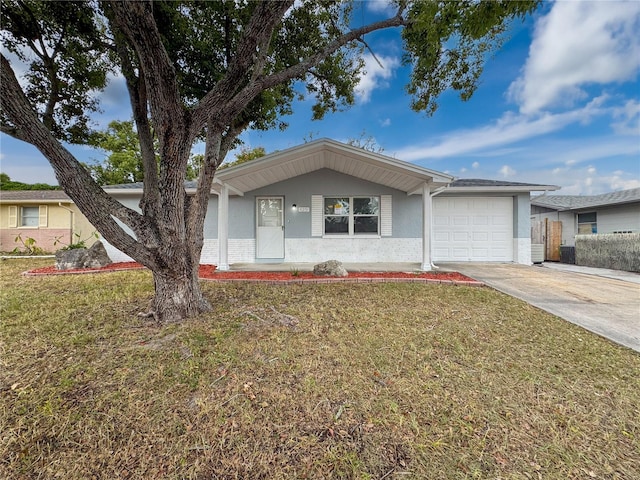 single story home featuring a front lawn and a garage