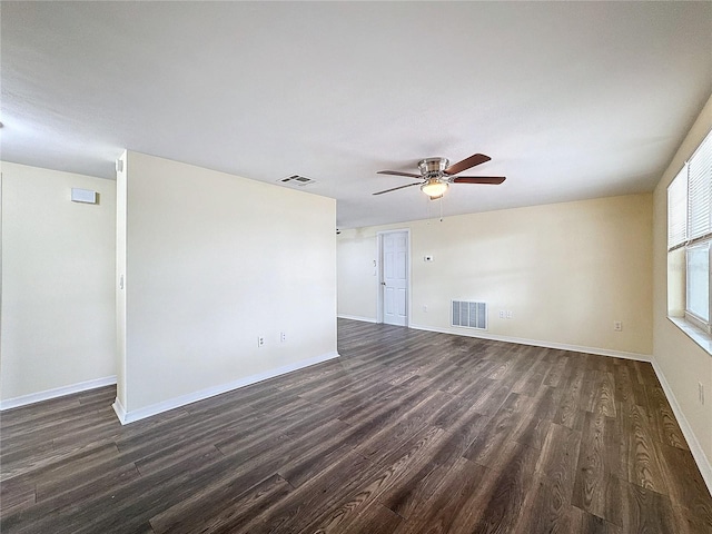 spare room with dark hardwood / wood-style floors and ceiling fan