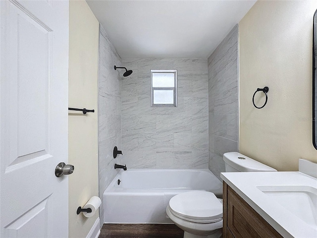 full bathroom with wood-type flooring, vanity, toilet, and tiled shower / bath