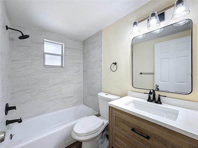 full bathroom with tiled shower / bath, toilet, and vanity