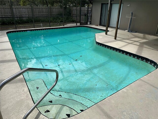 8353 Forest Oaks Blvd, Spring Hill, FL 34606 - view of swimming pool featuring fence and a patio area