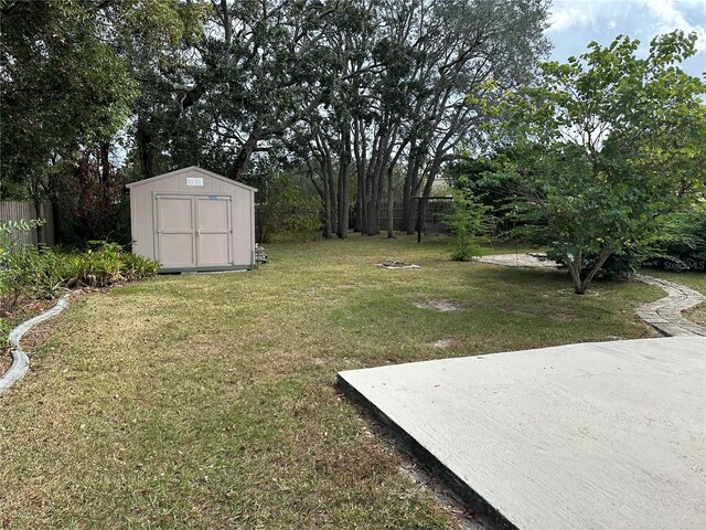 8353 Forest Oaks Blvd, Spring Hill, FL 34606 - view of yard with a storage unit and an outbuilding