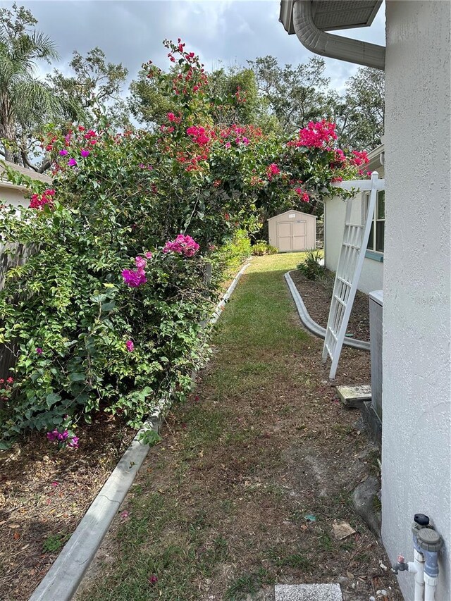 8353 Forest Oaks Blvd, Spring Hill, FL 34606 - view of yard featuring a storage shed and an outdoor structure