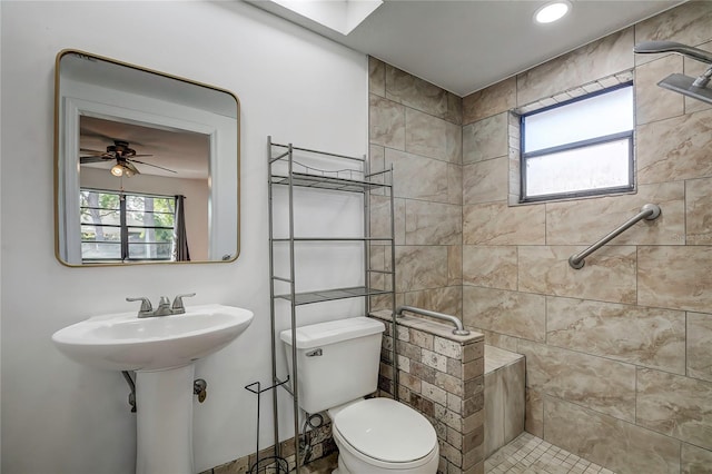 bathroom featuring ceiling fan and toilet