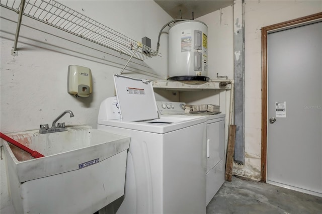 clothes washing area featuring water heater, sink, and washer and clothes dryer