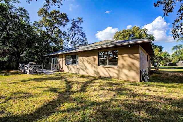 view of side of home featuring a lawn