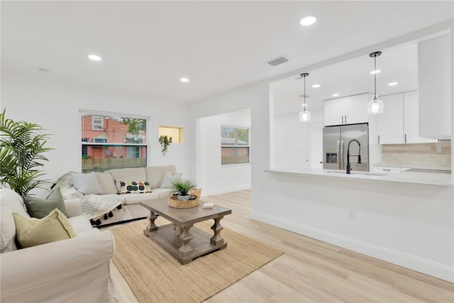 living room with light hardwood / wood-style floors