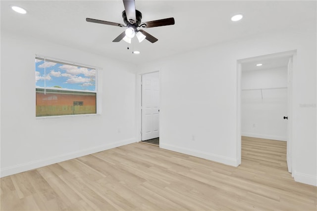 unfurnished room featuring ceiling fan and light hardwood / wood-style floors