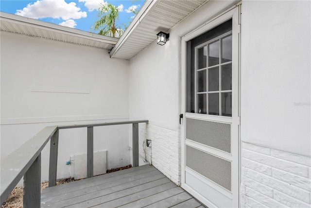 property entrance with a wooden deck