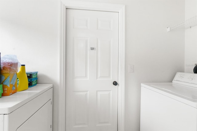 washroom featuring washing machine and dryer