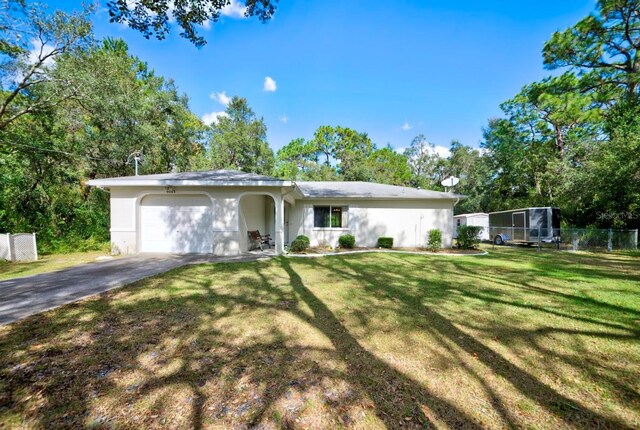 ranch-style home featuring a garage and a front yard