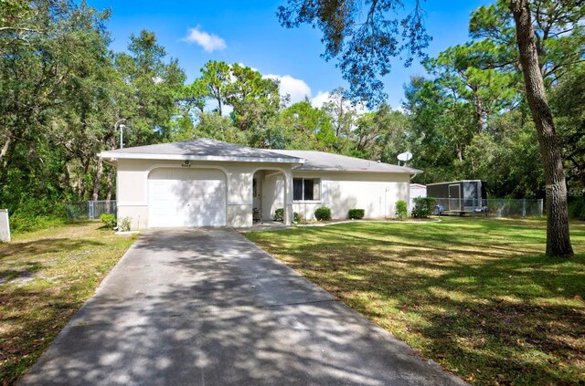 ranch-style house featuring a garage and a front yard