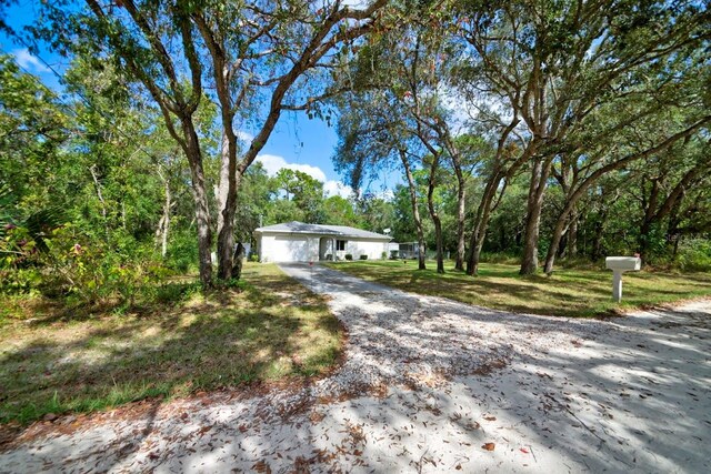 single story home featuring a garage