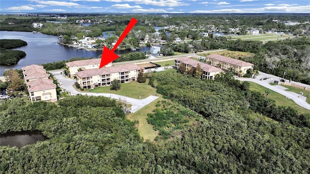 birds eye view of property with a water view