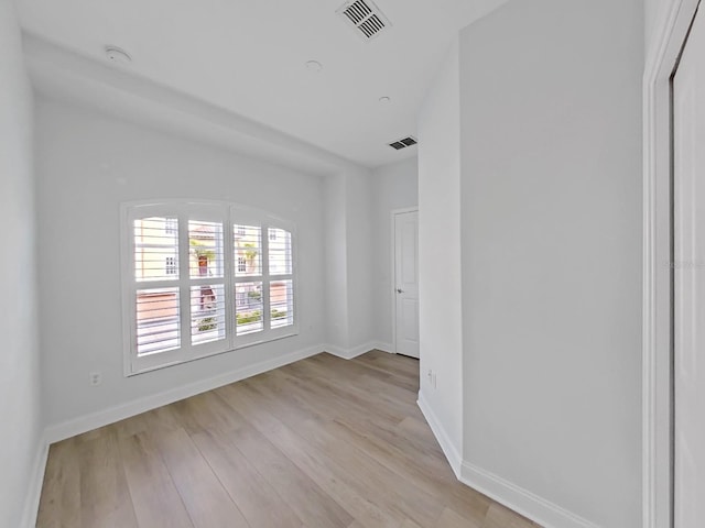 spare room with light hardwood / wood-style flooring