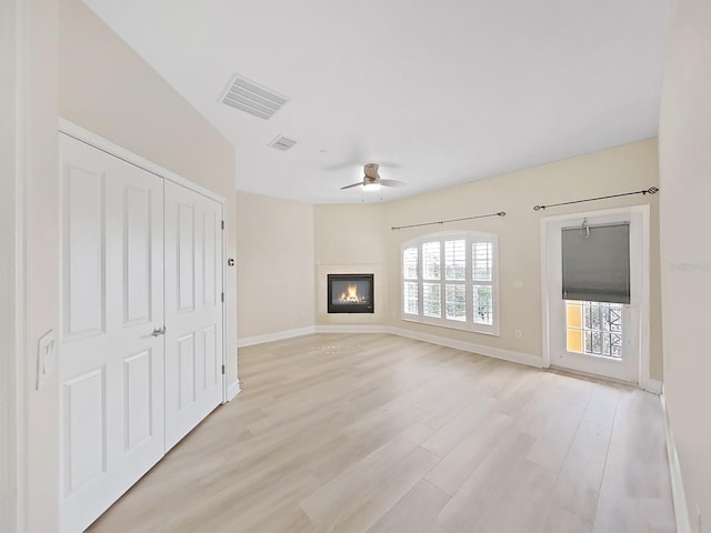 unfurnished living room with light hardwood / wood-style floors and ceiling fan