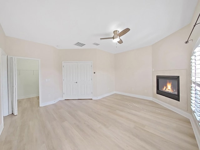 interior space with light wood-type flooring and ceiling fan