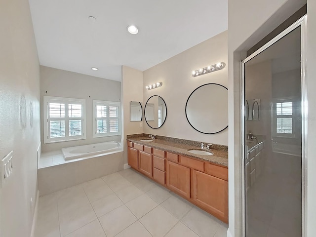 bathroom with vanity, independent shower and bath, and tile patterned flooring