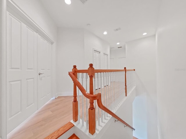 stairway featuring wood-type flooring