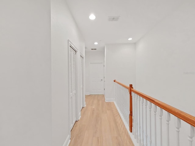 hall with light hardwood / wood-style flooring