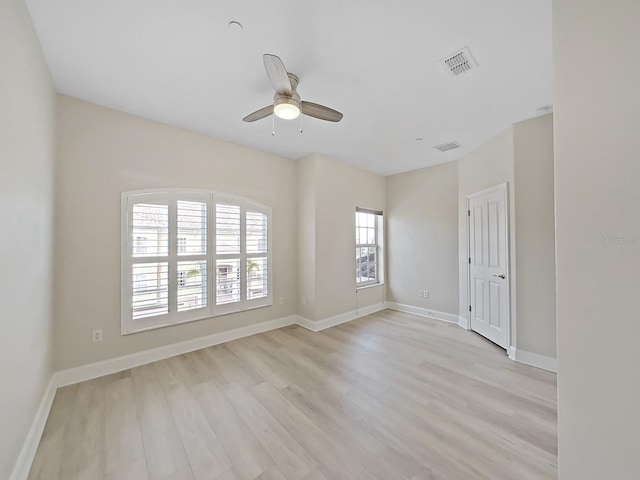 unfurnished room with ceiling fan and light wood-type flooring