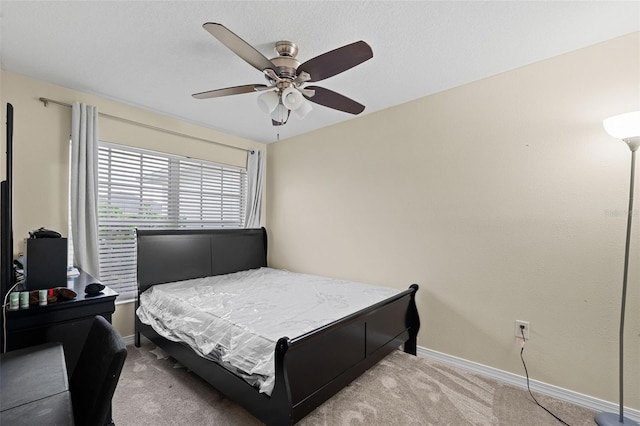 bedroom featuring carpet flooring, a ceiling fan, and baseboards