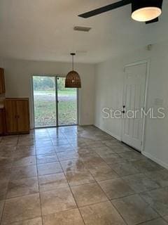 unfurnished room with light tile patterned floors