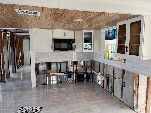 kitchen with white cabinetry and wooden ceiling