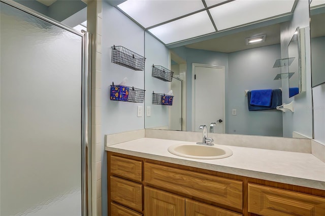 bathroom featuring vanity and an enclosed shower