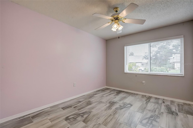 empty room featuring a textured ceiling, ceiling fan, and light hardwood / wood-style flooring