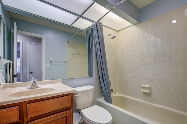 full bathroom featuring vanity, toilet, and shower / bath combination with curtain