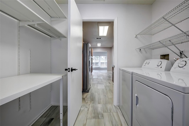7499 Heather Walk, Weeki Wachee, FL 34613 - washroom with independent washer and dryer and baseboards
