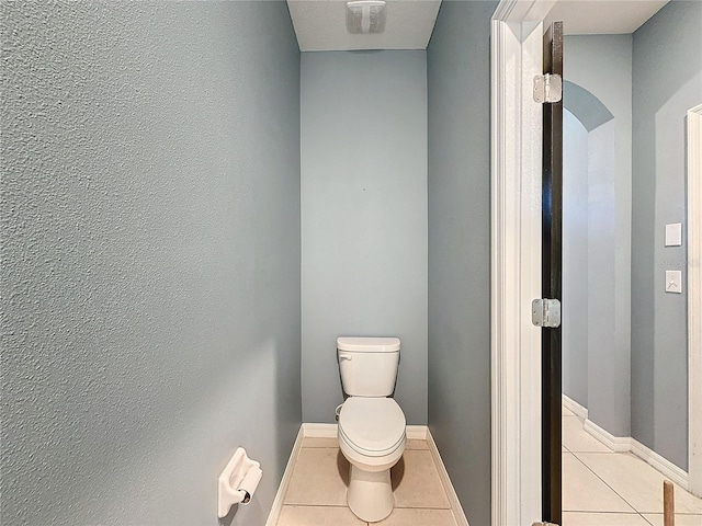 bathroom with tile patterned floors and toilet