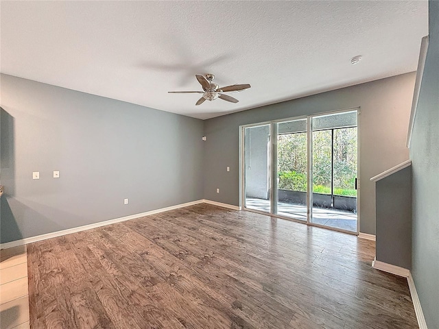 unfurnished room featuring hardwood / wood-style floors, a textured ceiling, and ceiling fan