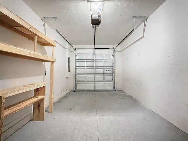 garage featuring electric panel and a garage door opener