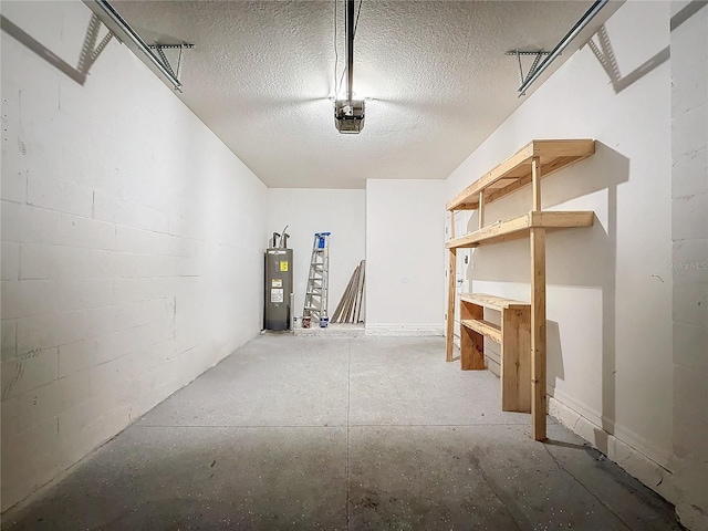 interior space featuring electric water heater and a garage door opener