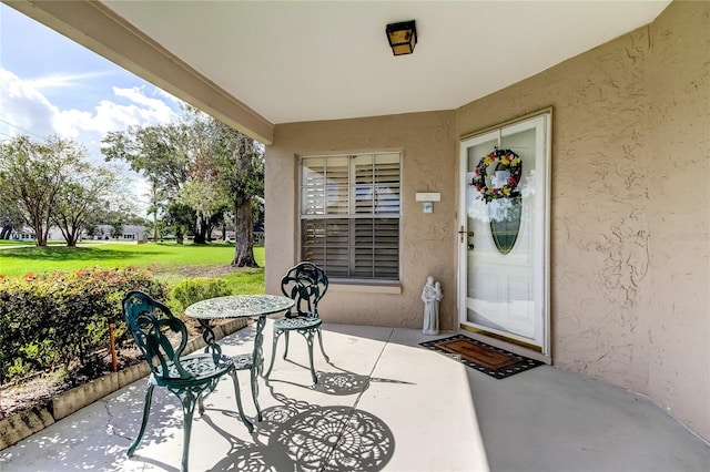 property entrance with a patio