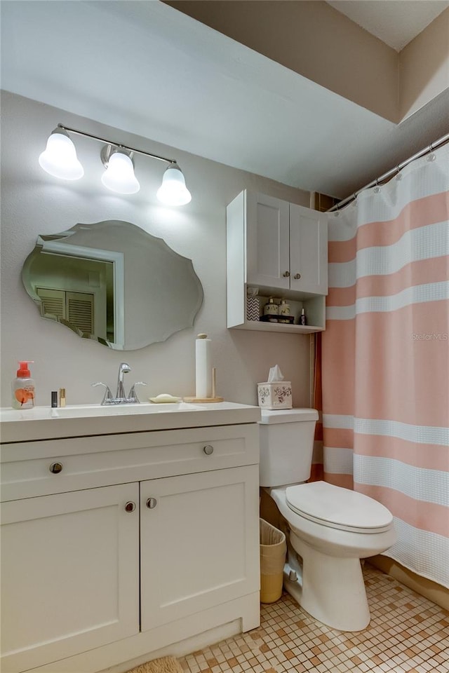 bathroom with vanity, toilet, and a shower with shower curtain