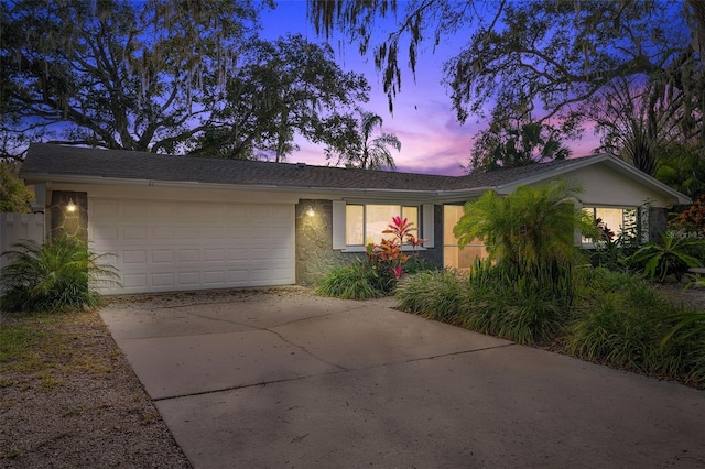 ranch-style house featuring a garage