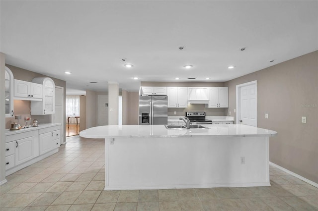 kitchen featuring a kitchen island with sink, appliances with stainless steel finishes, white cabinetry, and sink