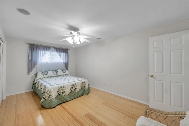 bedroom with wood-type flooring and ceiling fan