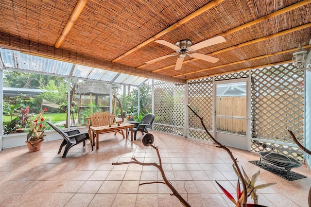 sunroom with ceiling fan and a healthy amount of sunlight